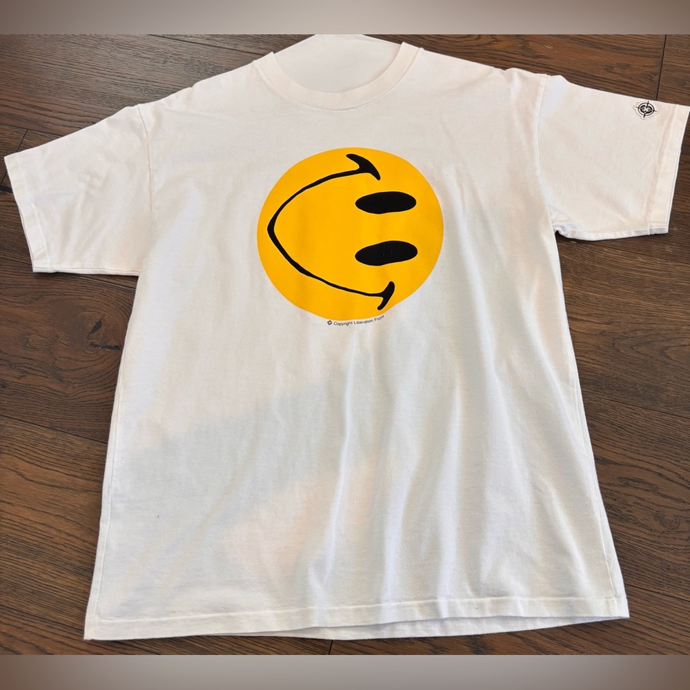 White Graphic Tee with Yellow Smiley